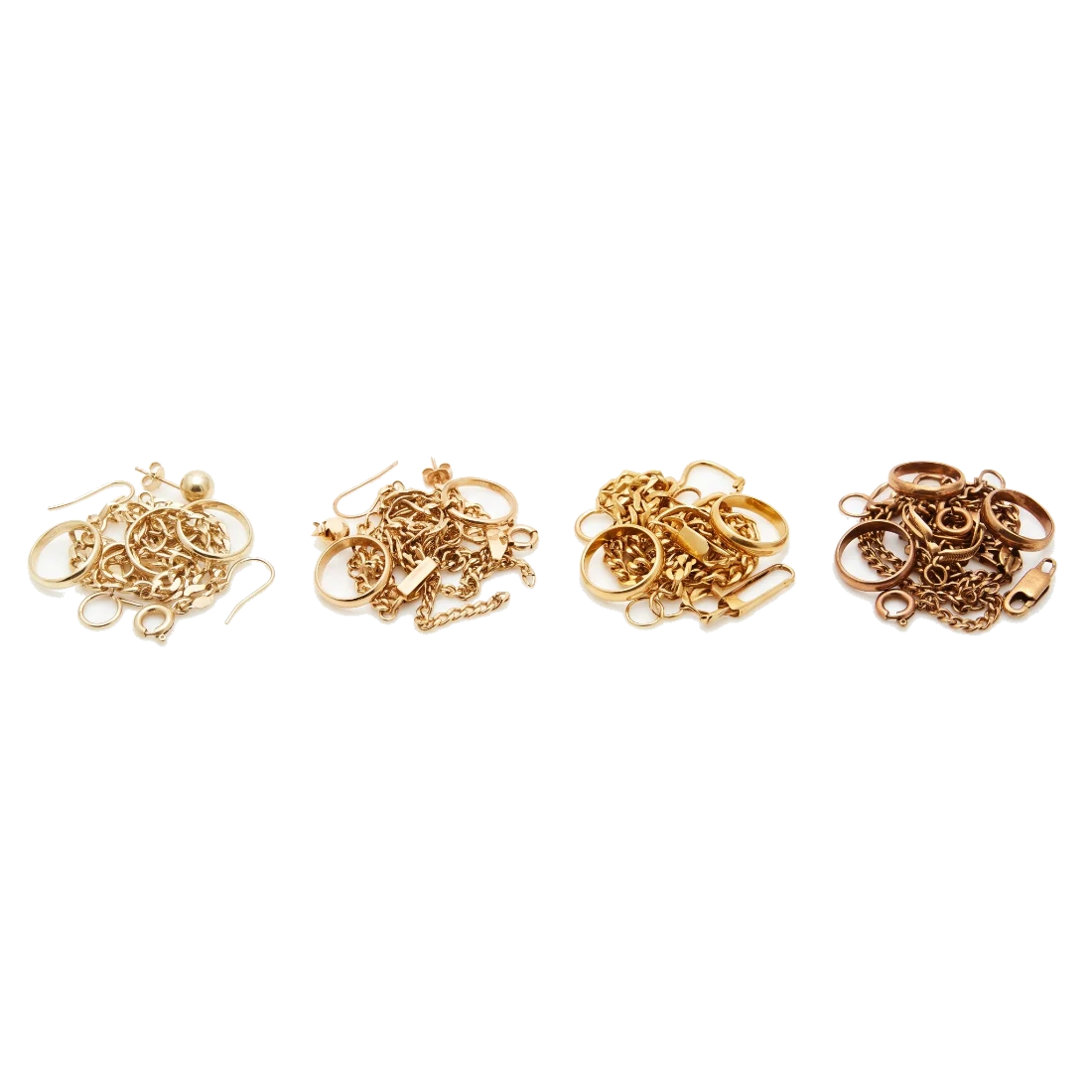 Four small piles of scrap gold jewellery set apart from each other, each pile a different shade of yellow.