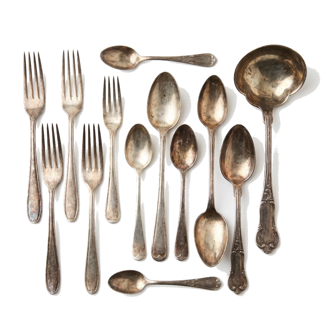 Tarnished sterling silver flatware, mismatched forks and spoons.